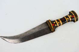 A Syrian jambiya dagger with wood and bone hilt,