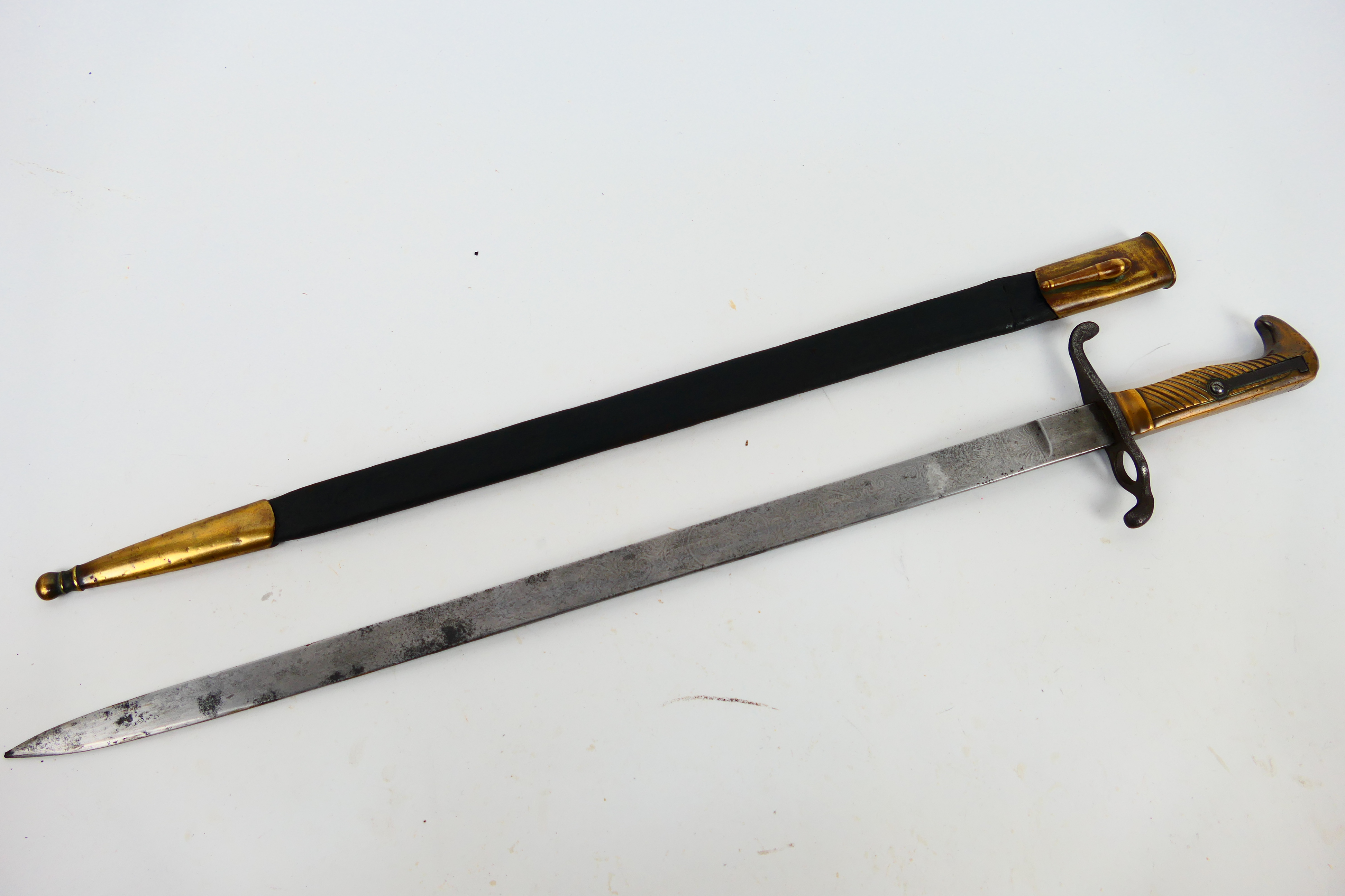 An 1871 pattern dress bayonet with 48 cm (l) double etched blade (faintly visible),