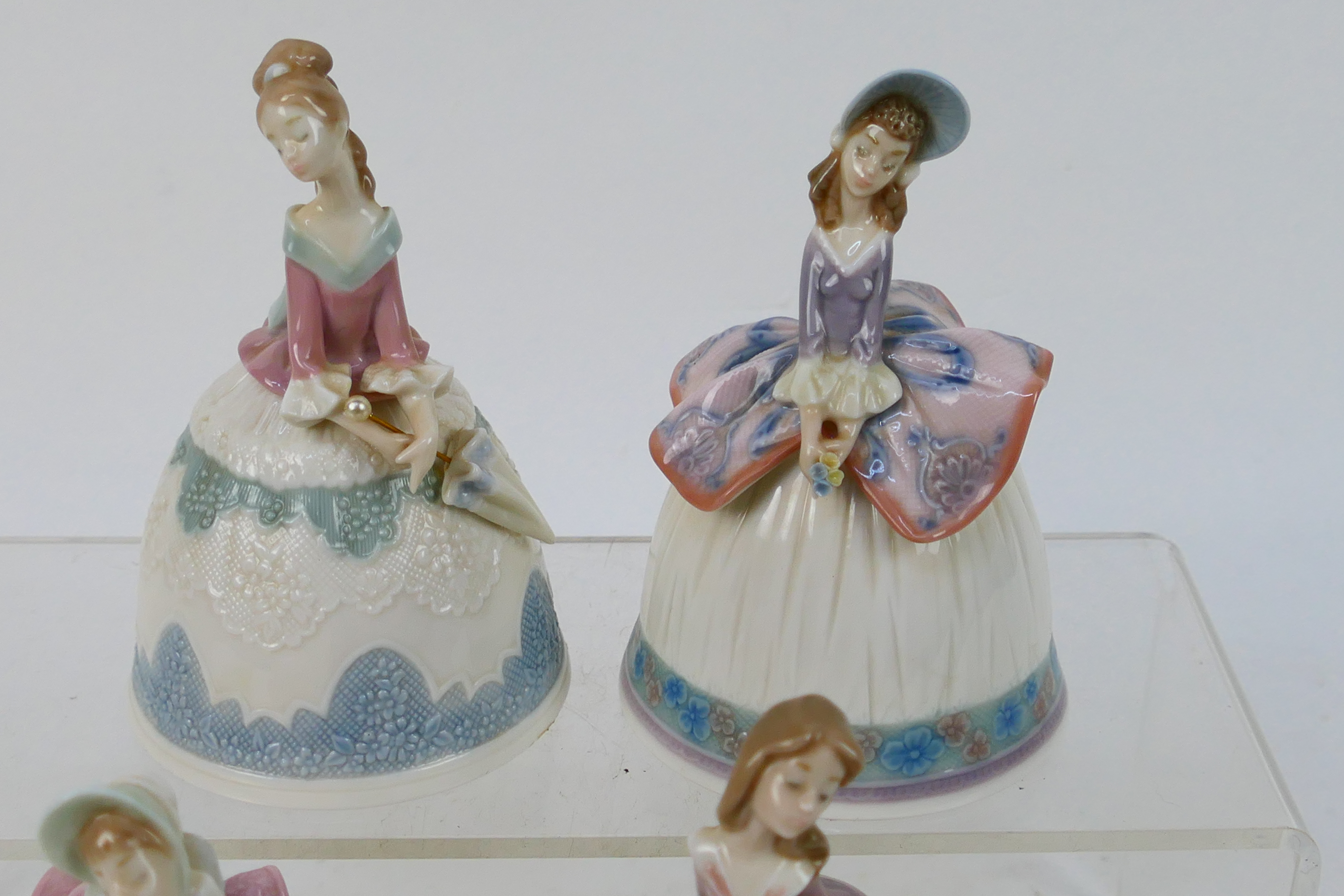 Lladro - Four porcelain bells in the form of ladies, approximately 12 cm (h). - Image 3 of 6