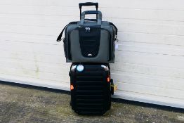 An Eminent wheeled case with attached Samsonite laptop case.