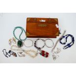 A collection of costume jewellery to include brooches, bracelets, necklaces and other,