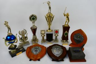 A collection of vintage sporting trophies, largest approximately 43 cm (h).