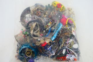 A sealed bag containing approximately 4.5 kg of various costume jewellery.