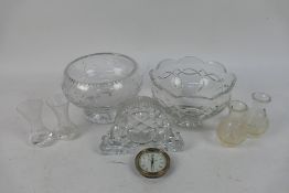 Two crystal bowls, two crystal bud vases and a Waterford Crystal clock.