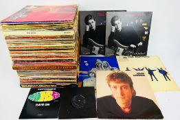 A collection of vinyl records, predominantly 12", to include The Rolling Stones, The Beatles,