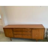 A Sutcliffe of Todmorden sideboard credenza, three central drawers flanked by cupboards,