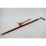 A walking stick with chrome jaguar form handle and a copper hunting horn. [2].