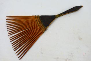 Polynesian carved wood and wirework comb, 26 cm (l). [W].