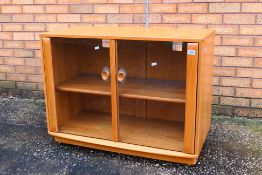 Ercol - A Windsor twin door display cabinet or glazed bookcase, approximately 68 cm x 92 cm x 44 cm.