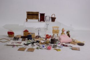 A collection of dolls house accessories to include baskets, 4 x draw cabinet (Missing one draw),