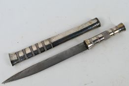 A Bhutanese dagger with white metal and wire bound hilt and scabbard, blade 15 cm (l).