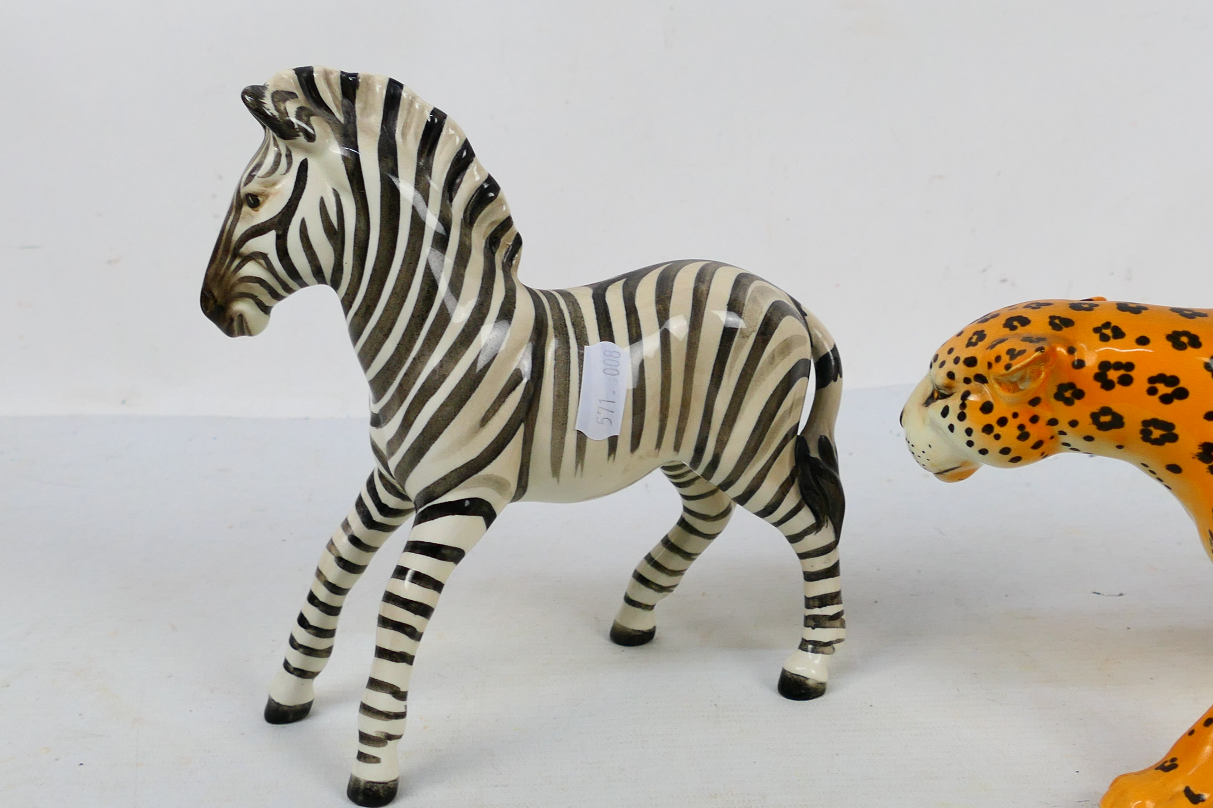 Two Beswick animal studies comprising leopard and zebra, largest approximately 30 cm (l). [2]. - Image 5 of 7