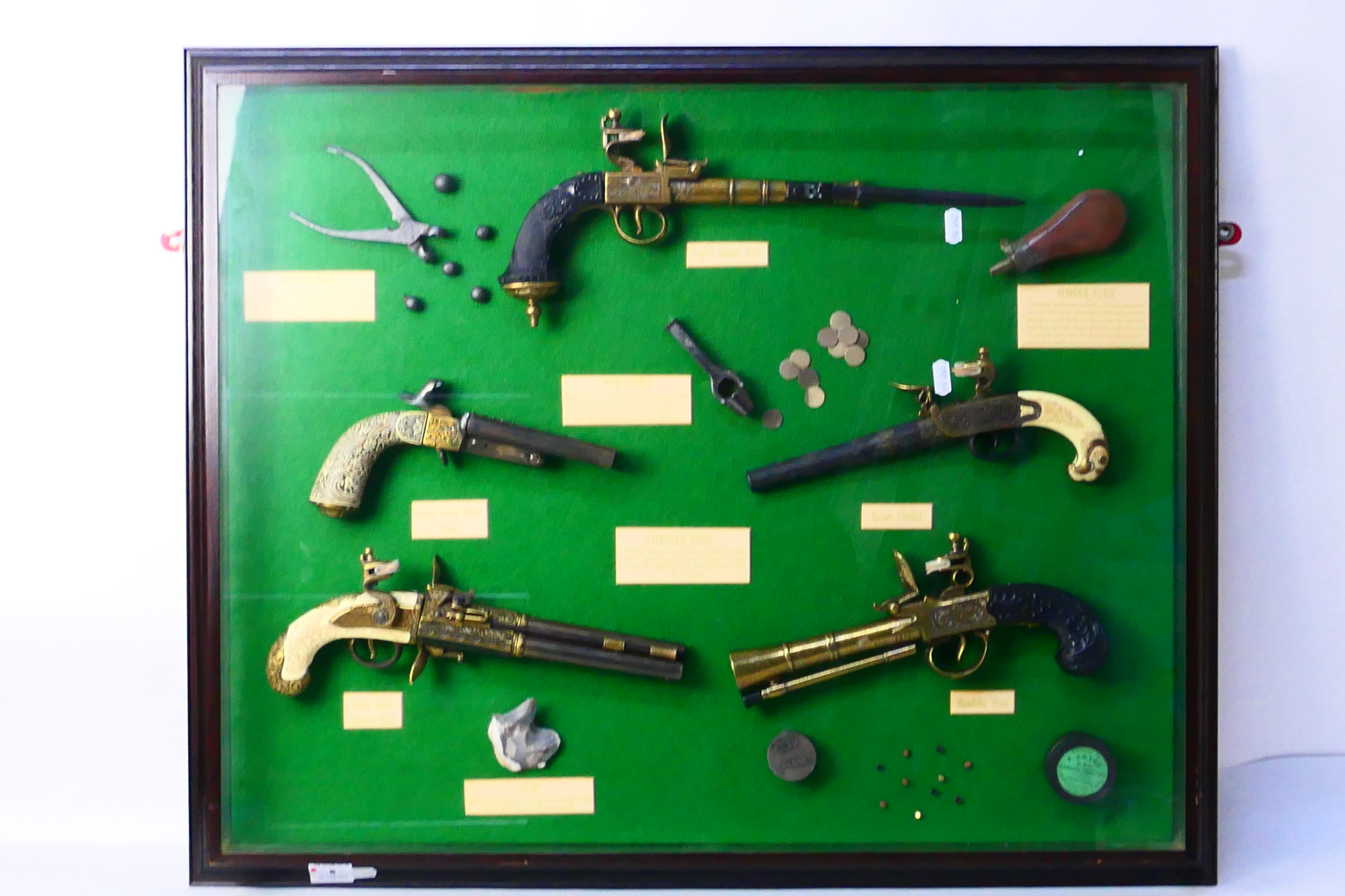 A framed display of reproduction early f