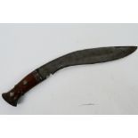 A vintage kukri with 30 cm (l) blade, wooden hilt and steel chapri.