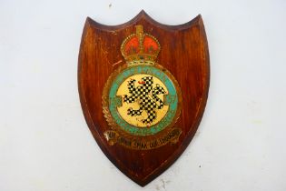 A World War Two RAF Squadron plaque, 157 Squadron, hand painted metal badge on wooden shield plaque,