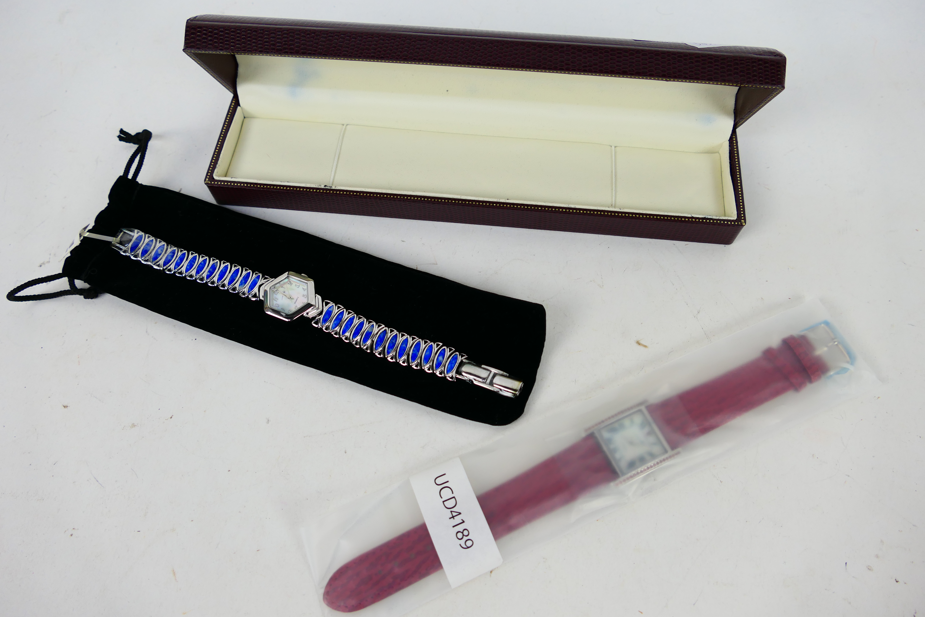 Unused Shop Stock - Two wrist watches including one with silver case.