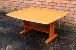 Ercol - A drop leaf coffee table, approximately 48 cm x 104 cm x 46 cm x (90 cm when open).