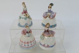 Lladro - Four porcelain bells in the form of ladies, approximately 12 cm (h).