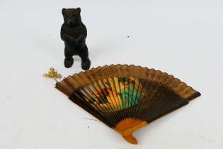 Lot to include a black painted brass money bank in the form of a standing bear, 15 cm (h),