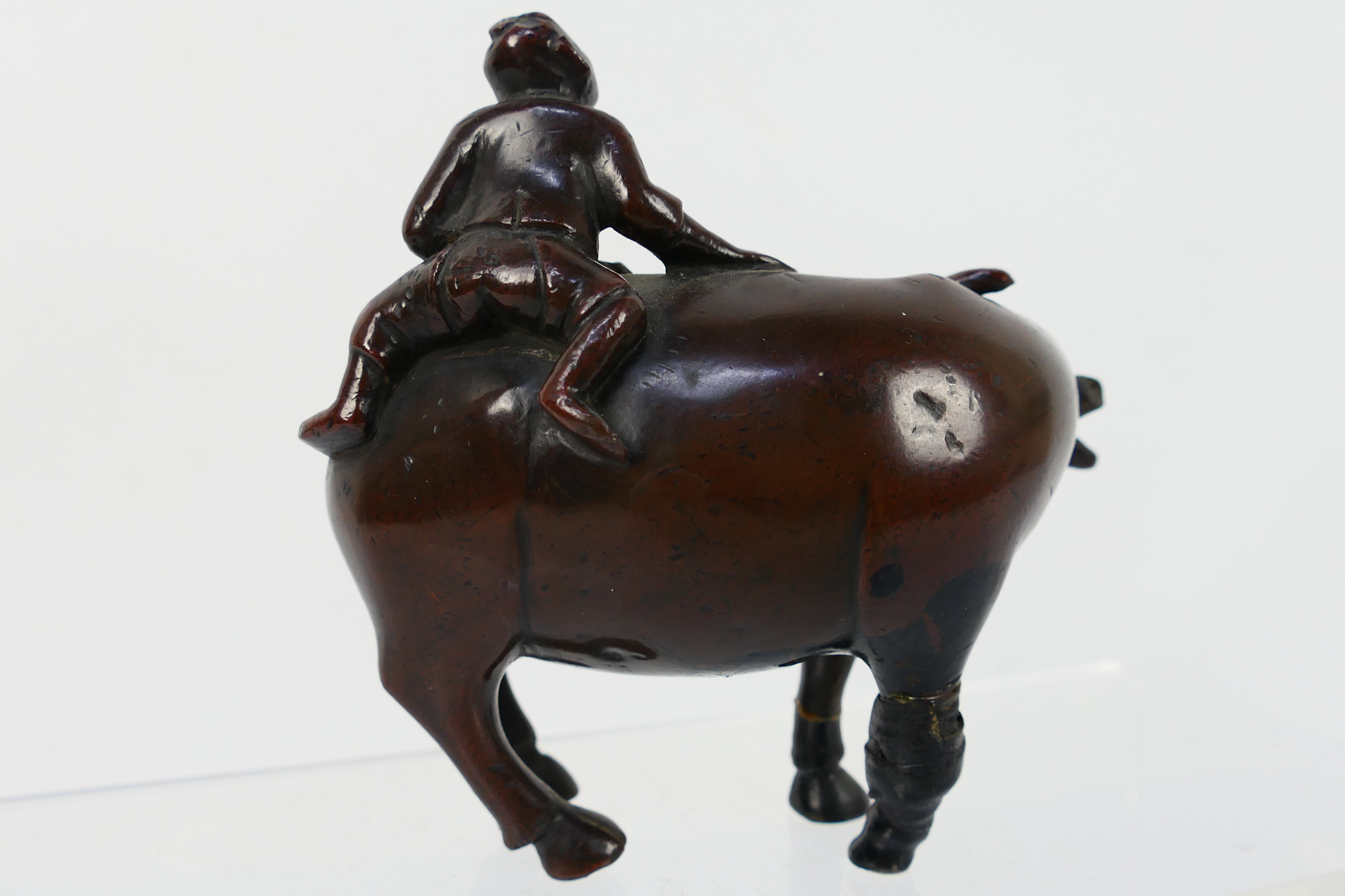A Chinese bronze Buffalo and Boy group modelled as a boy atop a buffalo (A/F), - Image 4 of 4