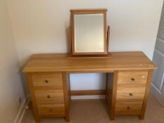 A Corndell Furniture Co dressing table with swing mirror and three drawers to each side,
