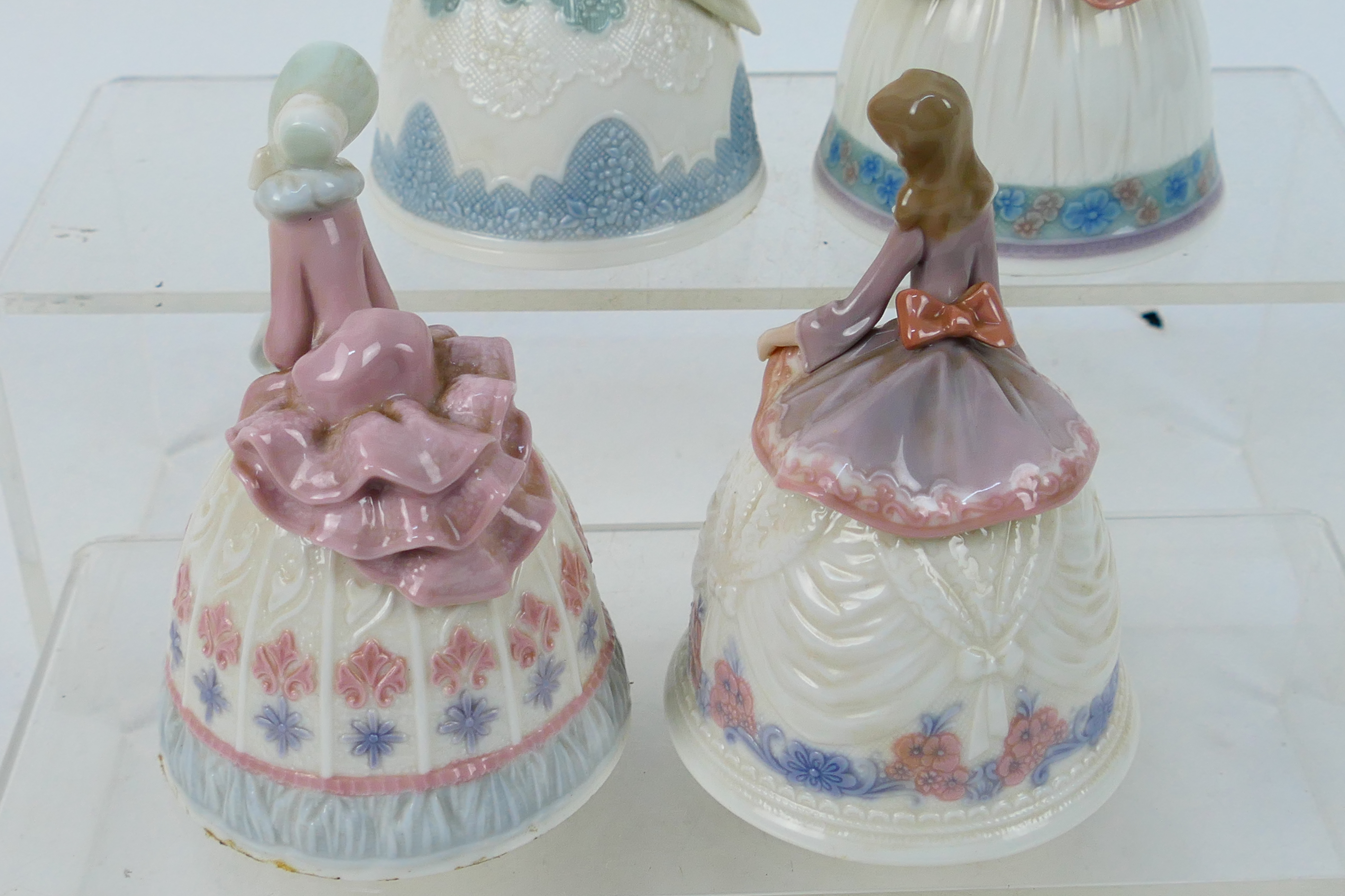Lladro - Four porcelain bells in the form of ladies, approximately 12 cm (h). - Image 4 of 6