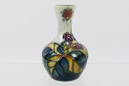 Moorcroft - A small Moorcroft Pottery vase decorated in the Bramble pattern, 1994,