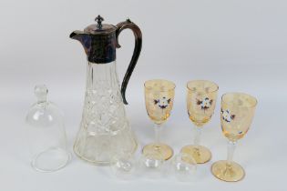 A cut glass decanter with plated mount,