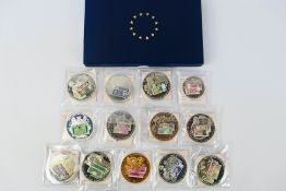 A collection of Windsor Mint British Banknote commemorative coins.