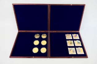 Two coin collector cases,