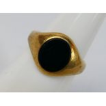 A 9ct yellow gold and onyx signet ring, size K+½, approximately 4.3 grams.