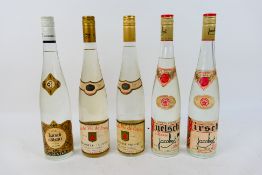Five vintage bottles of Eau de Vie or fruit spirit comprising three Kirsch, 24 fl ozs and 70° Proof,