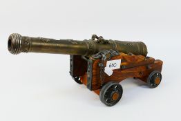 A brass table cannon model of a Spanish El Tigre 1797 cannon,