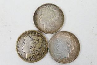 US Silver Coins - Three silver dollars comprising a 1901 Morgan (New Orleans),