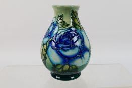 Moorcroft - A Moorcroft Pottery vase, decorated in the Roses pattern, impressed marks to the base,