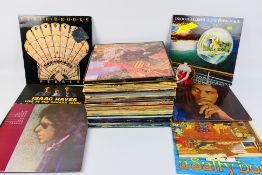 A collection of 12" vinyl records to include Bob Marley, UB40, Procol Harum, Bob Dylan, Status Quo,