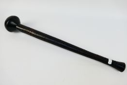 An African Knobkerrie war club with carved decoration, approximately 53 cm (l).