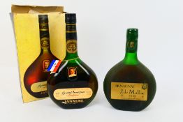 A 1970's bottling of Janneau Grand Armagnac VSOP, 24 fl oz and 70° Proof (boxed) and a 0.