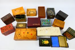 A quantity of playing card and similar boxes.
