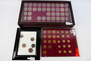 Three coin displays comprising a display case of 20th century pennies and similar. [3].