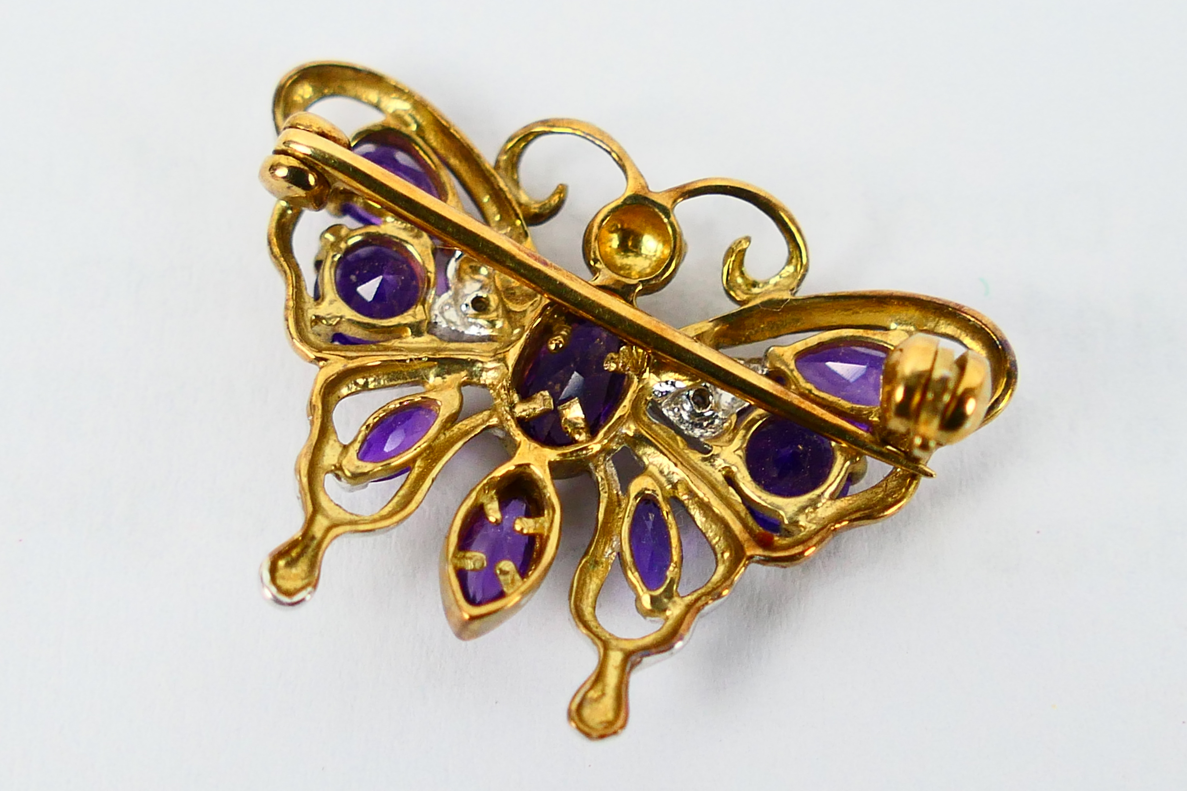 A 9ct gold, amethyst and diamond butterfly brooch, 2.5 cm wingspan, 2.8 grams. - Image 2 of 2