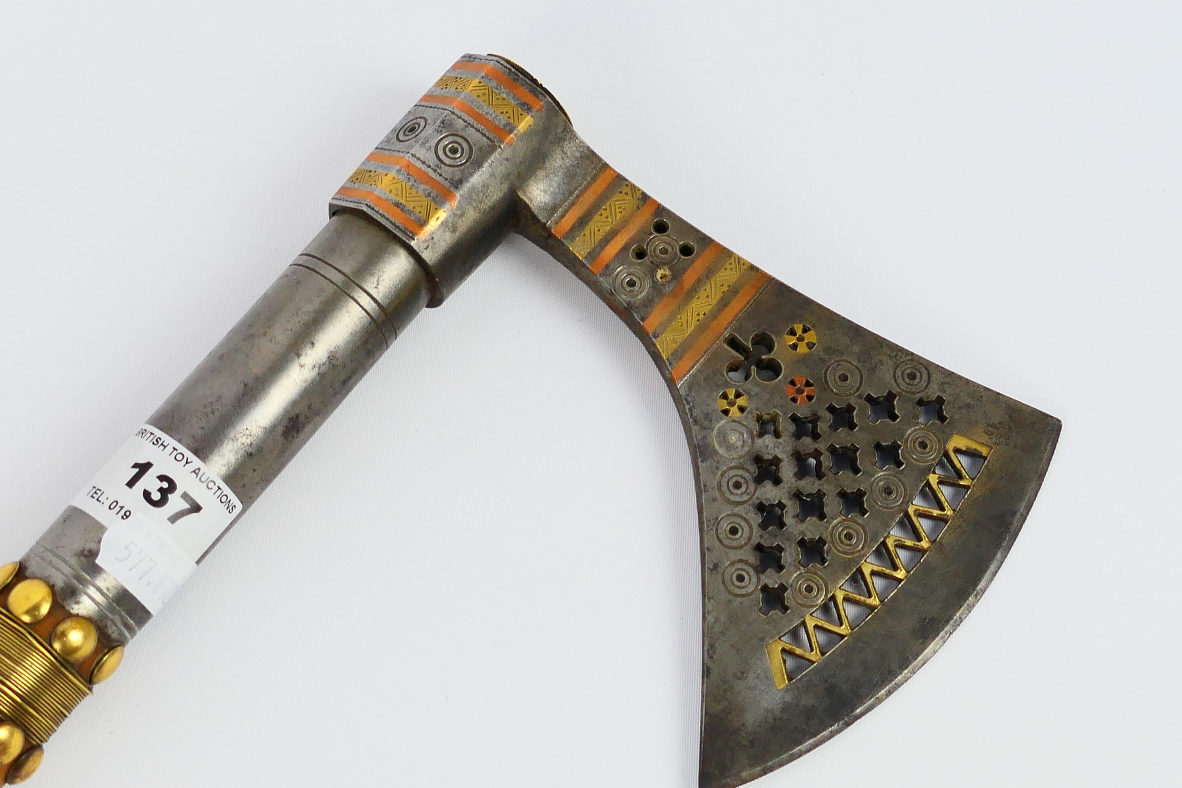 A North Indian axe (Tabarzin) with pierced wedge shaped head on brass mounted wooden haft, - Image 2 of 9