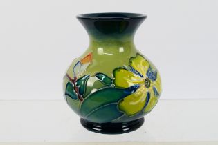 Moorcroft - A small Moorcroft Pottery vase, 1994, decorated in the Hypericum pattern,