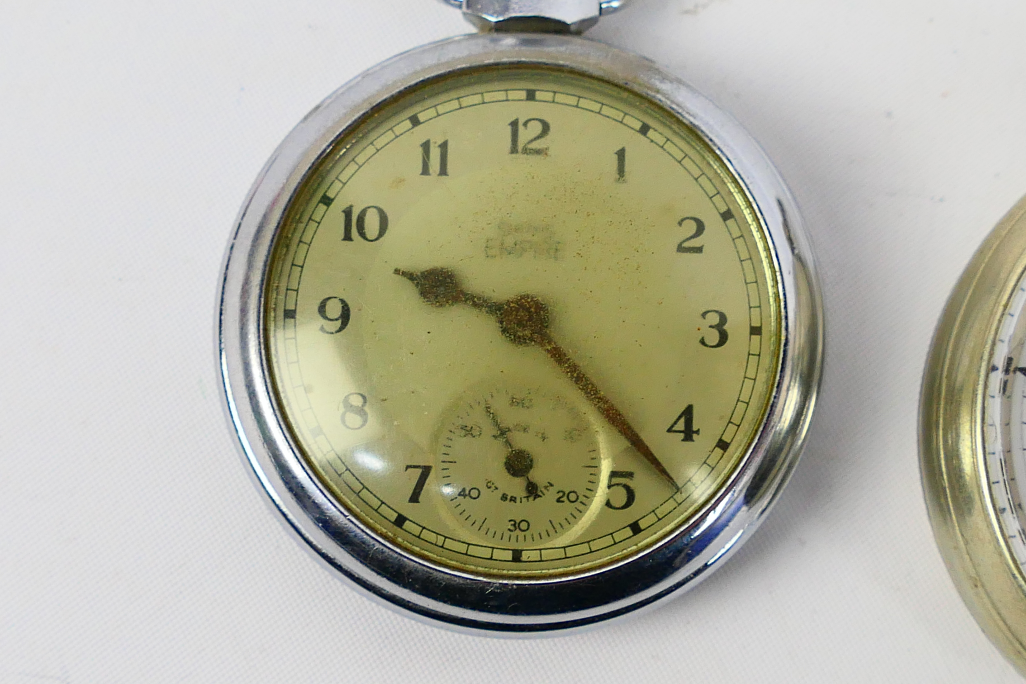 A white metal cased open face pocket watch with Roman numerals to a white enamel dial, - Image 2 of 7