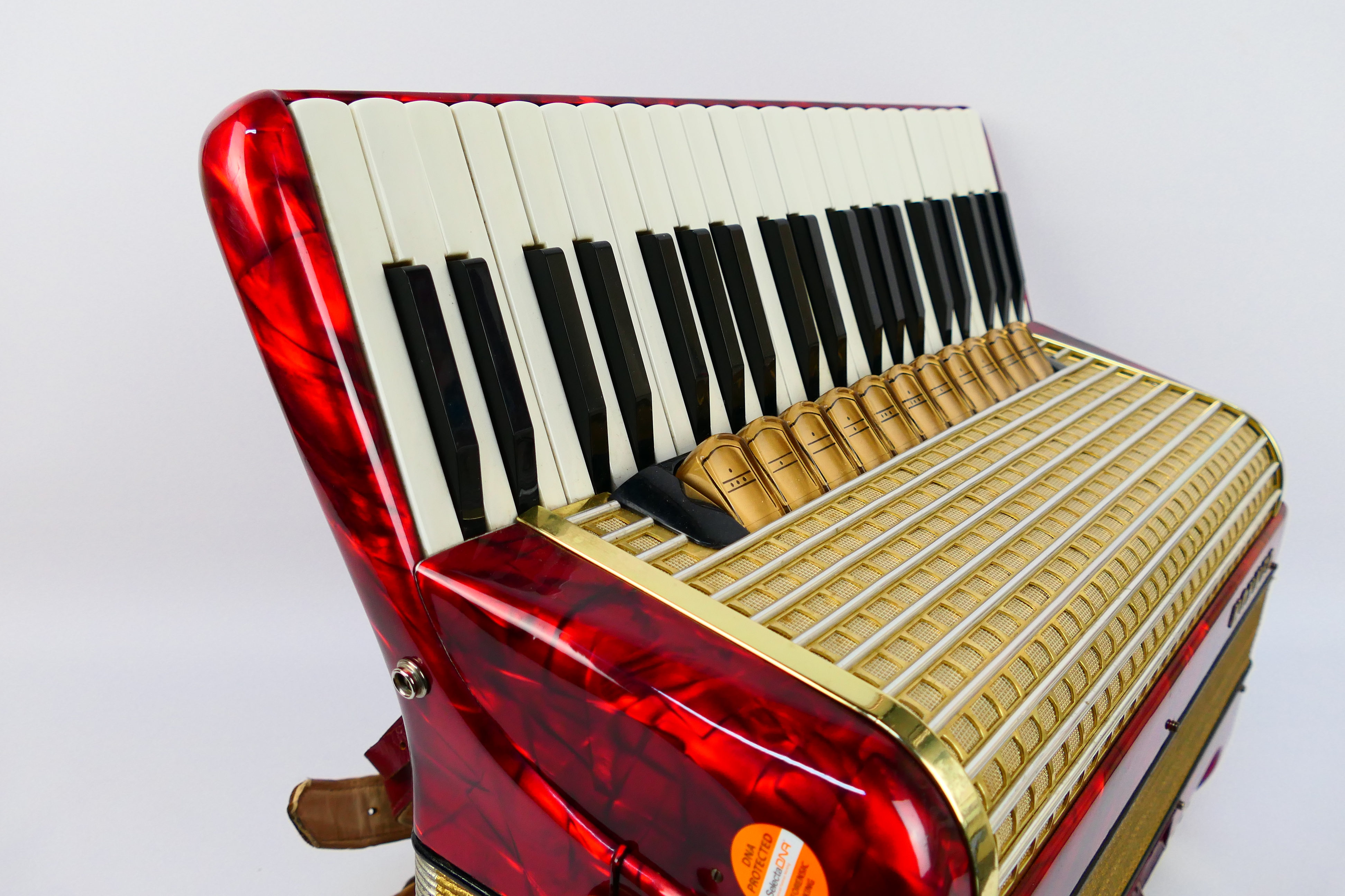 A vintage Hohner Verdi VM piano accordion, 41 keys and 120 basses, marbled red finish, - Image 12 of 18