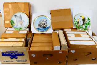 A quantity of collector plates contained in boxes / shipping packaging to include ships, birds,
