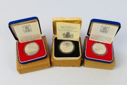 Three silver proof coins comprising two Silver Jubilee examples and a Queen Mother 80th Birthday,