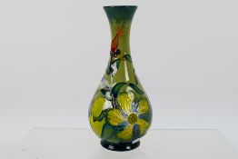 Moorcroft - A Moorcroft Pottery solifleur vase, 1994, decorated in the Hypericum pattern,