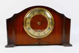 A Bentima mantel clock, with pendulum.