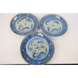 Three Chinese blue and white plates with fluted rim,